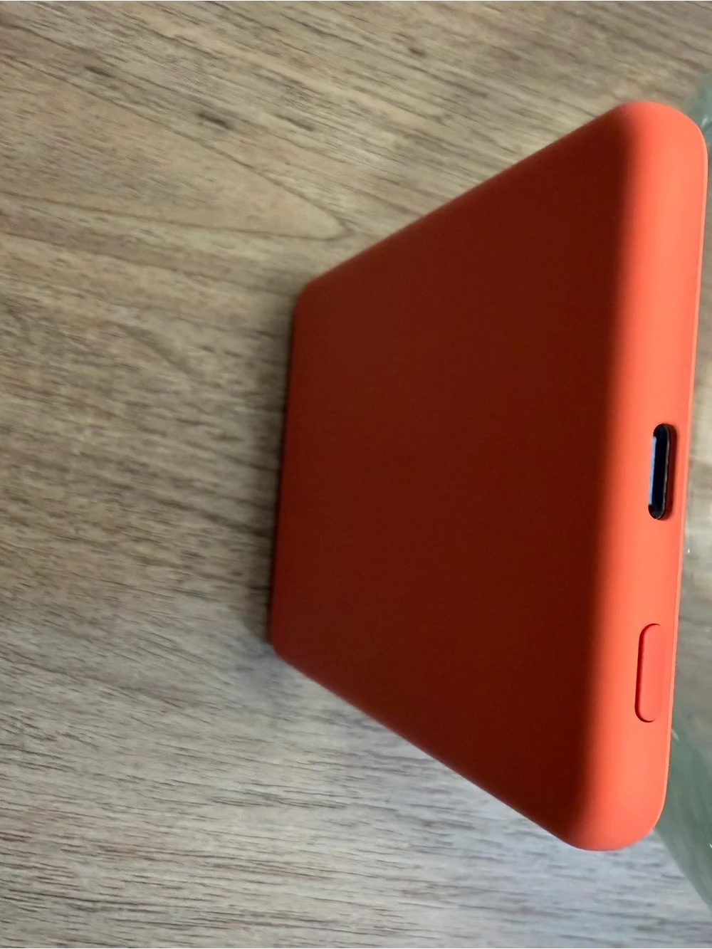 Anker Coral Orange Power Bank, Satechi Magnetic Wallet Stand, and Pop Socket